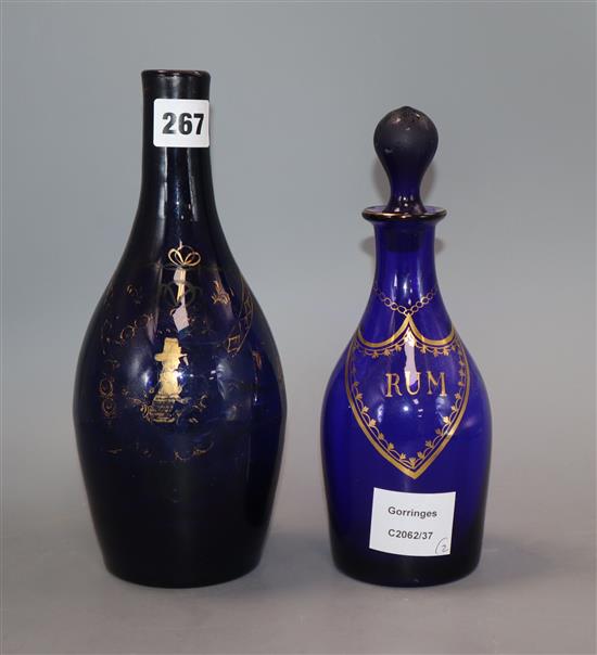 Two George III gilded blue glass decanters, one lacking stopper
